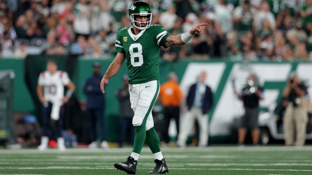 Sep 19, 2024; East Rutherford, New Jersey, USA; New York Jets quarterback Aaron Rodgers (8) reacts during the second quarter against the New England Patriots at MetLife Stadium.