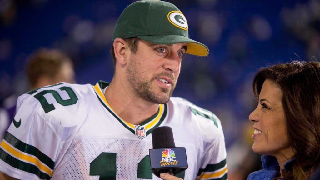 Oct 27, 2013; Minneapolis, MN, USA; Green Bay Packers quarterback Aaron Rodgers (12) answers questions from reporter Michelle Tafoya after the game against the Minnesota Vikings at Mall of America Field at H.H.H. Metrodome. The Packers win 44-31.