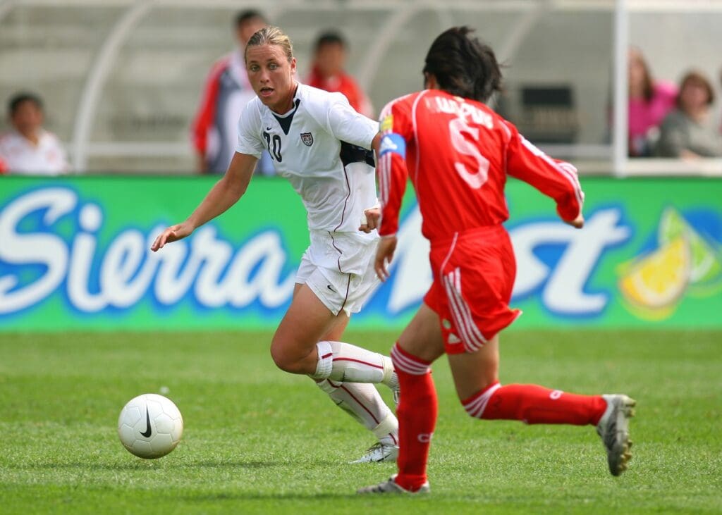 Aug 27, 2006; Bridgeview, IL, USA; USA forward (20) Abby Wambach (20) brings the ball upfield against China midfielder (5) Pu Wei during the second half at Toyota Park in Bridgeview, IL. Team USA defeated Team China 4-1.