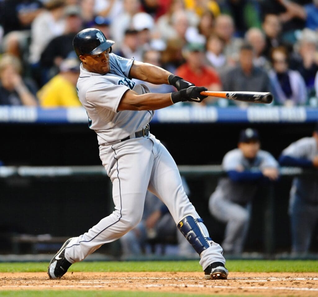 June 12, 2009; Denver, CO, USA; Seattle Mariners third basemen Adrian Beltre (29) hits a two run RBI double in the third inning against the Colorado Rockies at Coors Field.
