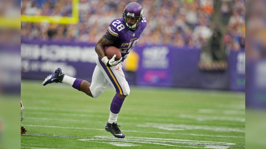 Sep 22, 2013; Minneapolis, MN, USA; Minnesota Vikings running back Adrian Peterson (28) rushes for 4 yards against the Cleveland Browns in the fourth quarter at Mall of America Field at H.H.H. Metrodome. The Browns win 31-27.