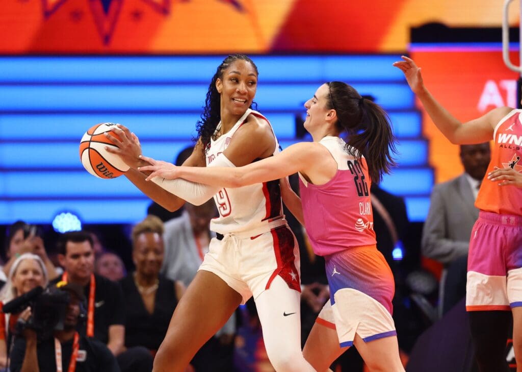 Jul 20, 2024; Phoenix, AZ, USA; USA Women's National Team forward A’ja Wilson (9) against Team WNBA guard Caitlin Clark (22) during the WNBA All Star game at Footprint Center.
