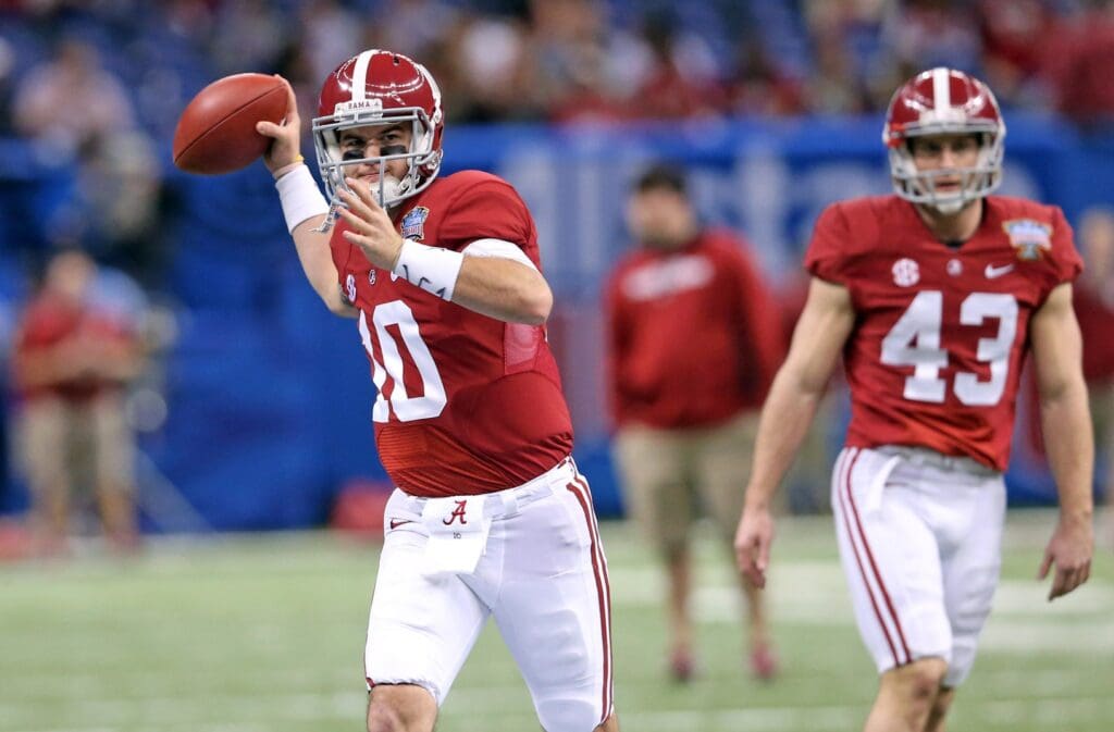 Jan 2, 2014; New Orleans, LA, USA; Alabama Crimson Tide quarterback AJ McCarron (10) warms up on the field prior to kickoff against the Oklahoma Sooners at the Mercedes-Benz Superdome.