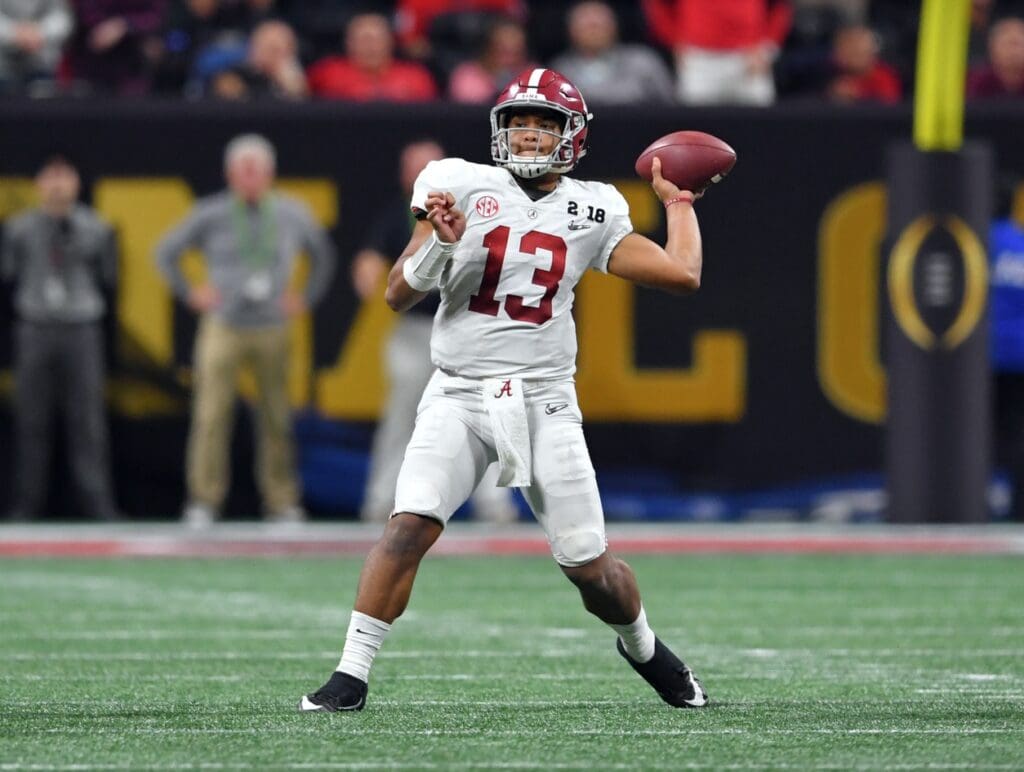 Jan 8, 2018; Atlanta, GA, USA; Alabama Crimson Tide quarterback Tua Tagovailoa (13) throws against the Georgia Bulldogs during the fourth quarter in the 2018 CFP national championship college football game at Mercedes-Benz Stadium.