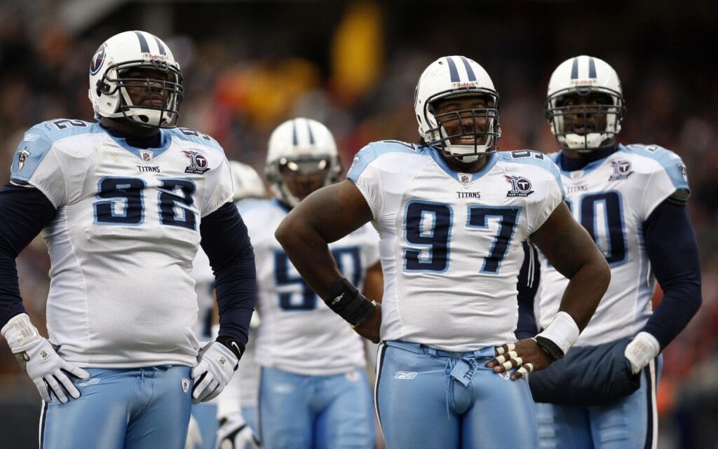 Nov 9, 2008; Chicago, IL, USA; Tennessee Titans defensive tackles Albert Haynesworth (92) and Tony Brown (97) rest between plays against the Chicago Bears during the first quarter at Soldier Field. The Titans beat the Bears 21-14.