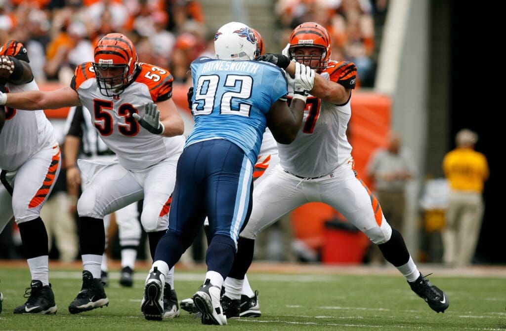 Sep 14, 2008; Cincinnati, OH, USA; Cincinnati Bengal left guard Andrew Whitworth (77) blocks the Tennessee Titans tackle Albert Haynesworth (92) in the second half at Paul Brown Stadium in Cincinnati, OH. The Titans defeated the Bengals 24-7.