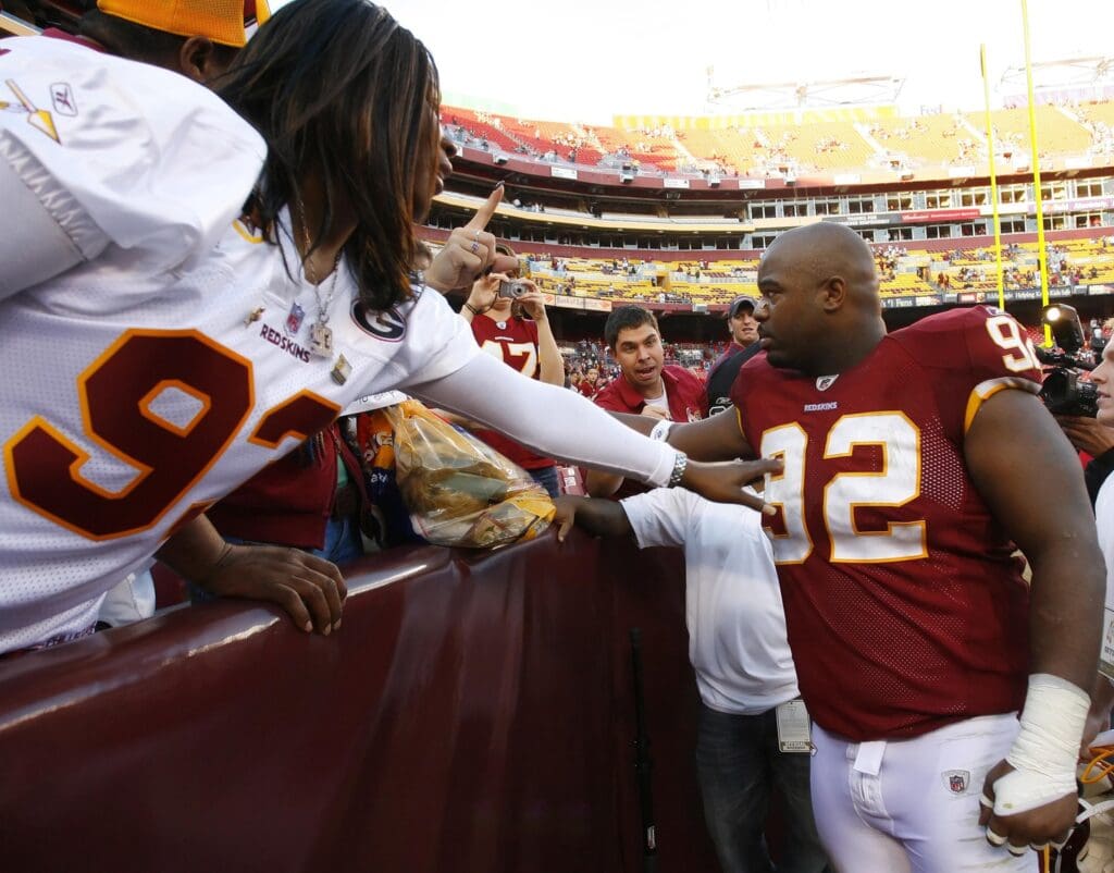 November 15, 2009; Landover, MD, USA; Washington Redskins defensive tackle Albert Haynesworth (92) shakes hands with fans after the Redskins game against the Denver Broncos at FedEx Field in Landover, Maryland. The Redskins won 27-17.