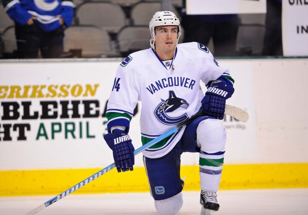 Mar 22, 2012; Dallas, TX, USA; Vancouver Canucks right wing Alex Burrows (14) warms up before the game against the Dallas Stars at the American Airlines Center. The Canucks defeated the Stars 2-1.