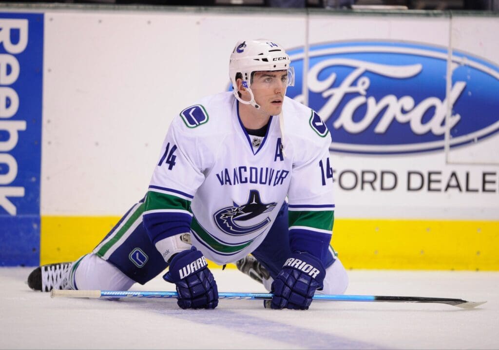 Feb 21, 2013; Dallas, TX, USA; Vancouver Canucks center Alex Burrows (14) warms up before the game against the Dallas Stars at the American Airlines Center. The Canucks defeated the Stars 4-3.