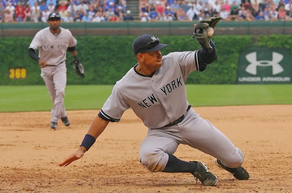 June 18, 2011; Chicago, IL, USA; New York Yankees third baseman Alex Rodriguez (13) makes a stop on a ball off the bat of Chicago Cubs left fielder Alfonso Soriano (not pictured) in the sixth inning at Wrigley Field.