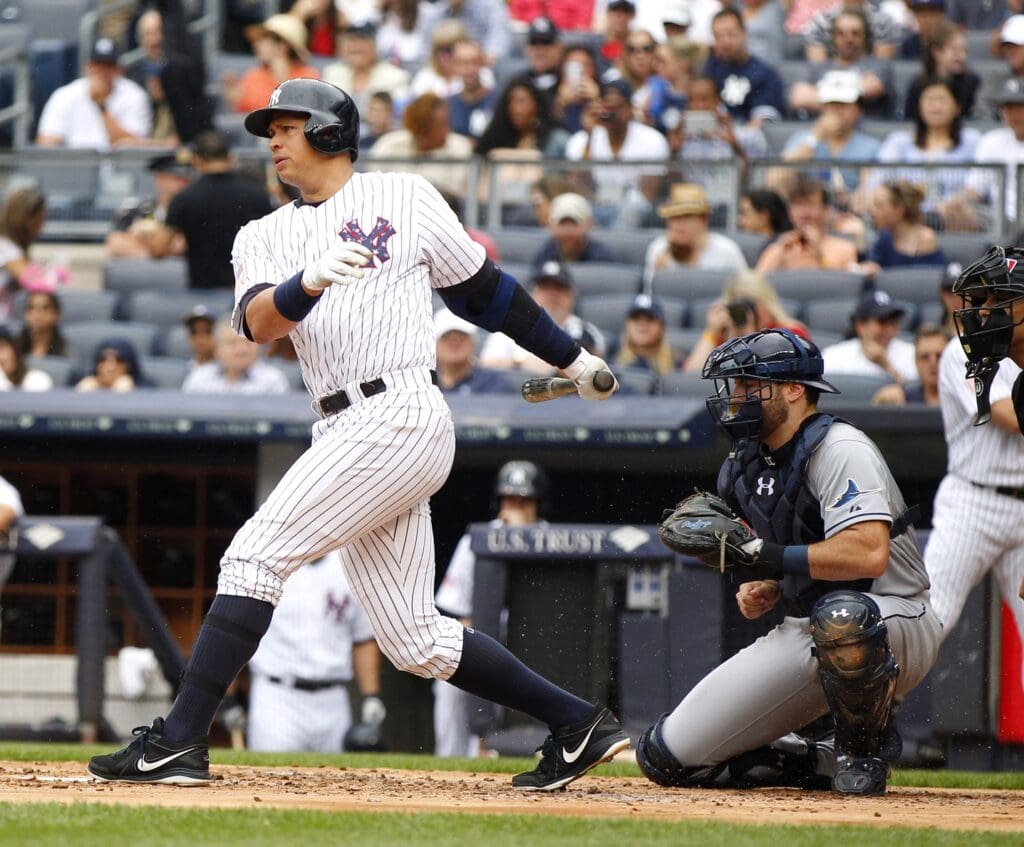 Jul 4, 2015; Bronx, NY, USA; New York Yankees designated hitter Alex Rodriguez (13) hits an RBI single in the first inning against the Tampa Bay Rays at Yankee Stadium