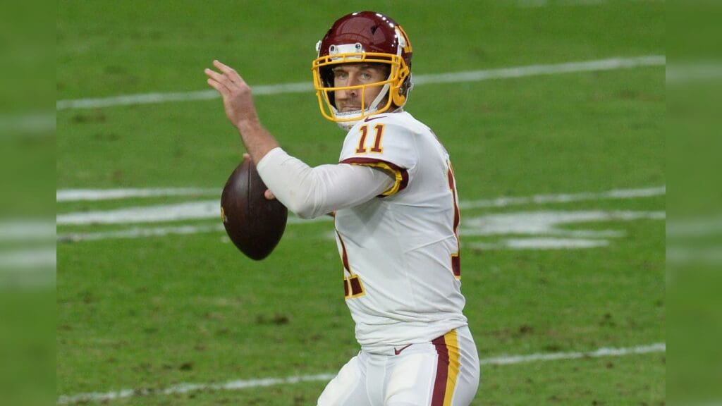 Dec 13, 2020; Glendale, Arizona, USA; Washington Football Team quarterback Alex Smith (11) throws a pass against the San Francisco 49ers during the first half at State Farm Stadium.