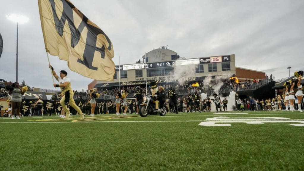 Sep 23, 2023; Winston-Salem, North Carolina, USA; The Wake Forest Demon Deacon rides his motorcycle onto the field leading the team against the Georgia Tech Yellow Jackets during the first half at Allegacy Federal Credit Union Stadium.