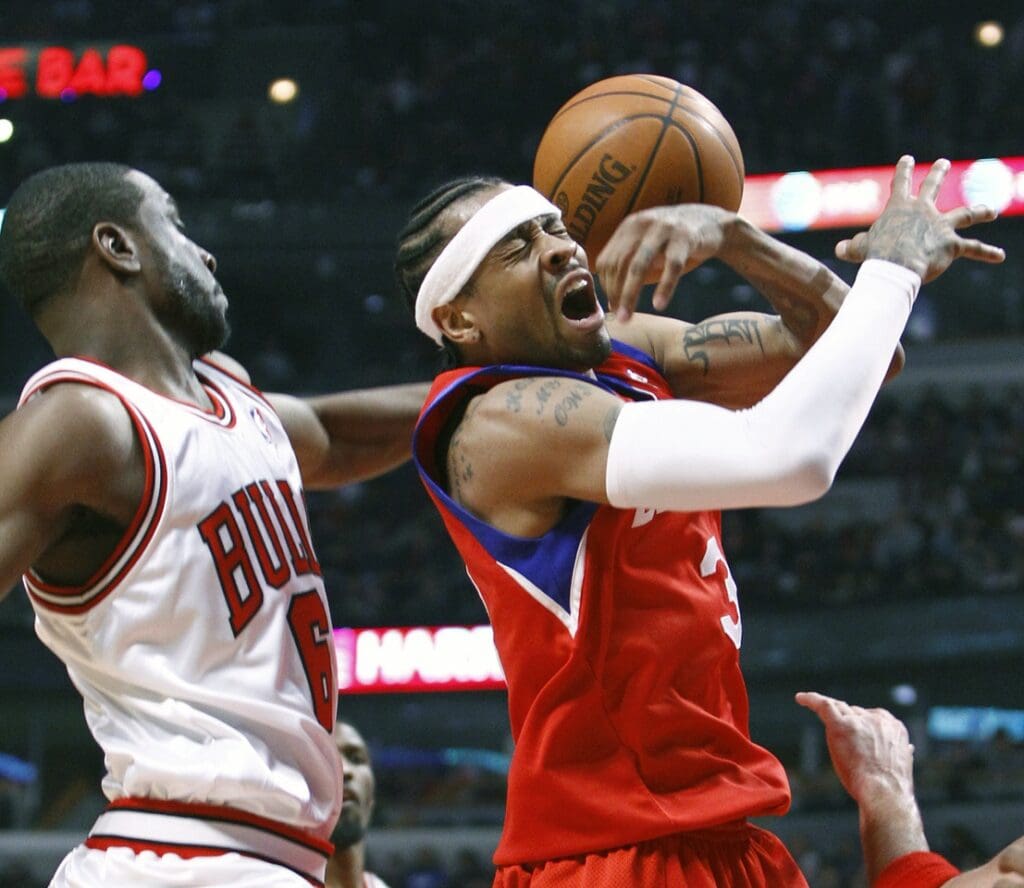 Feb 20, 2010; Chicago, IL, USA; Philadelphia 76ers guard Allen Iverson (3) gets the ball knocked away by Chicago Bulls guard Ronald Murray (6) during the first half at the United Center.