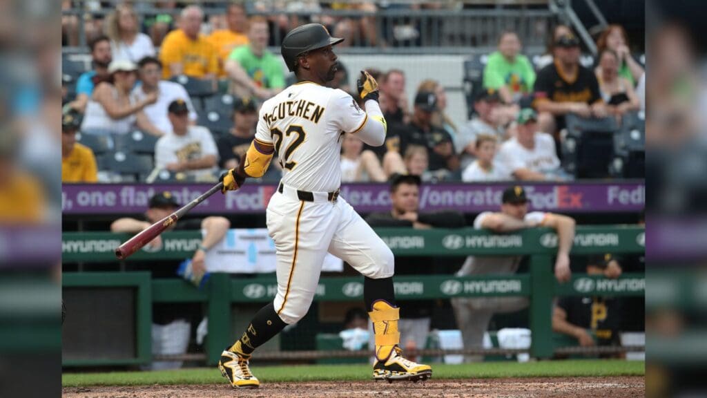Jun 28, 2025; Pittsburgh, Pennsylvania, USA; Pittsburgh Pirates designated hitter Andrew McCutchen (22) hits a two run single against the New York Mets during the eighth inning at PNC Park.