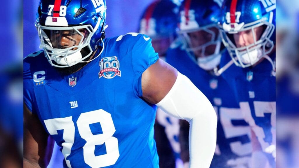 New York Giants offensive tackle Andrew Thomas (78) and his teammates run onto the field moments before kickoff, Sunday, October 13, 2024, in East Rutherford.
