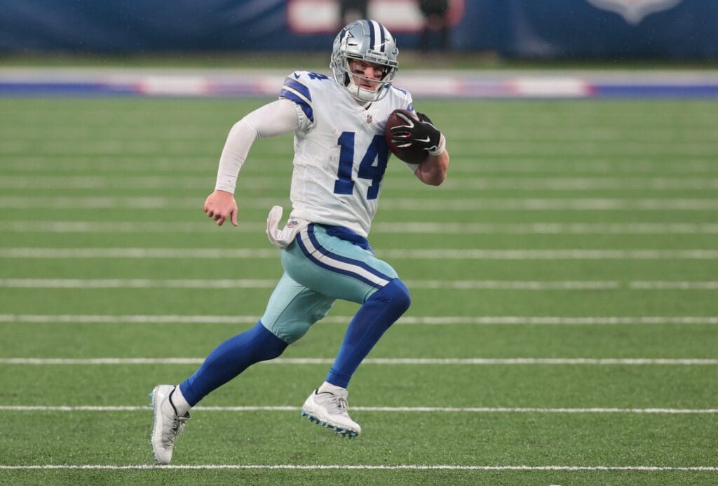 Jan 3, 2021; East Rutherford, NJ, USA; Dallas Cowboys quarterback Andy Dalton (14) runs the ball against the New York Giants in the second half at MetLife Stadium.