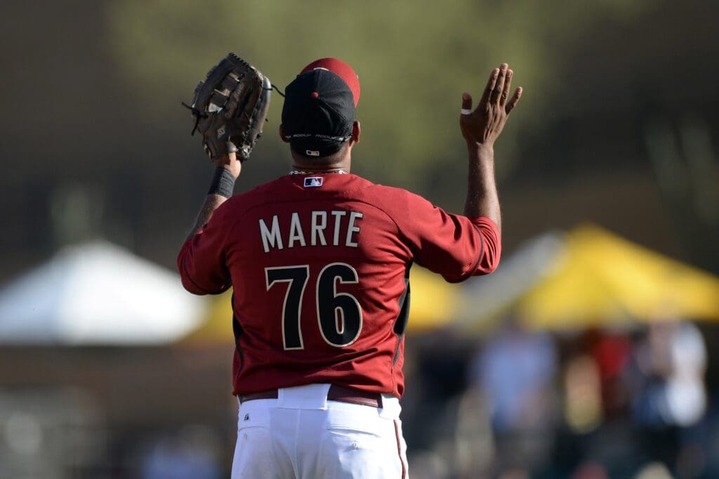 Feb 26, 2014; Salt River Pima-Maricopa, AZ, USA; Arizona Diamondbacks third baseman Andy Marte (76) celebrates after defeating the Los Angeles Dodgers at Salt River Fields at Talking Stick. The Los Angeles Dodgers won the game 4-1.