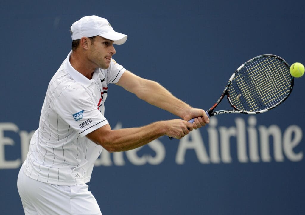 Sep 5, 2012; Queens, NY, USA; Andy Roddick (USA) returns a shot against Juan Martin Del Potro (ARG) on day ten of the 2012 US Open at Billie Jean King National Tennis Center.