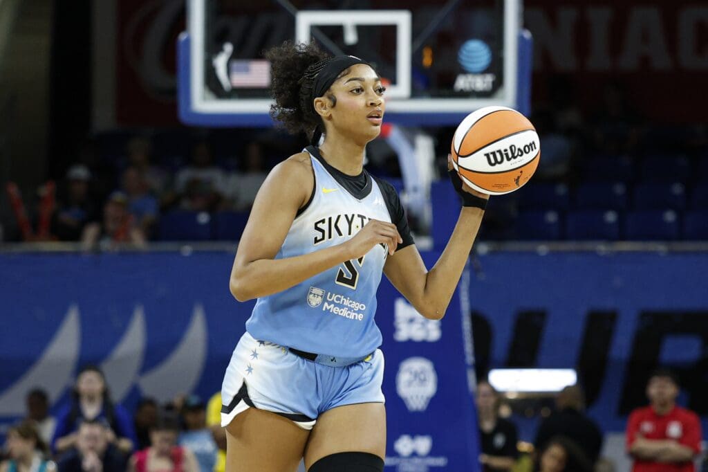 Jun 24, 2025; Chicago, Illinois, USA; Chicago Sky forward Angel Reese (5) passes the ball against the Los Angeles Sparks during the first half at Wintrust Arena