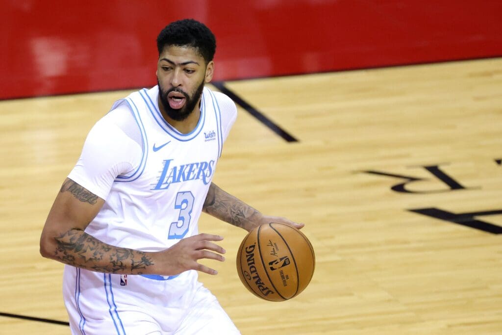 Jan 10, 2021; Houston, Texas, USA; Anthony Davis #3 of the Los Angeles Lakers controls the ball during the first quarter of a game against the Houston Rockets at Toyota Center on January 10, 2021 in Houston, Texas.