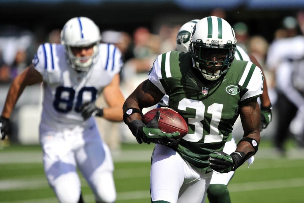 Oct 14, 2012; East Rutherford, NJ, USA; New York Jets cornerback Antonio Cromartie (31) returns an interception against the Indianapolis Colts during the first half at Metlife Stadium