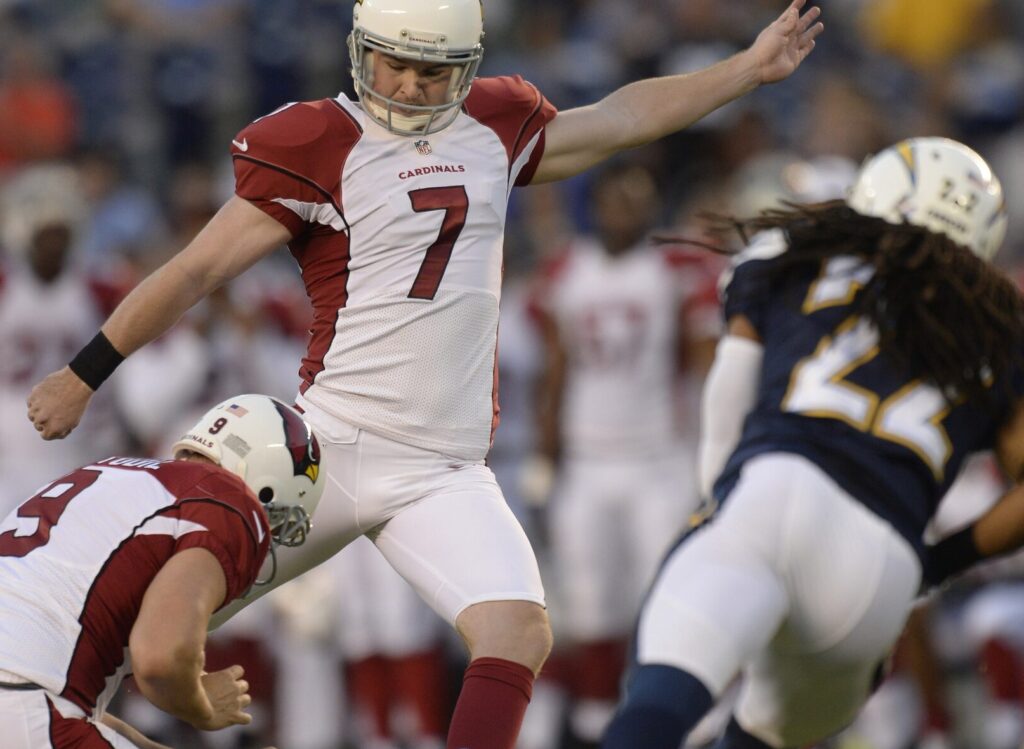 Aug 28, 2014; San Diego, CA, USA; Arizona Cardinals kicker Chandler Catanzaro (7) hits a 42-yard field goal in the first quarter against the San Diego Chargers at Qualcomm Stadium. Holding is Arizona Cardinals punter Dave Zastudil (9).