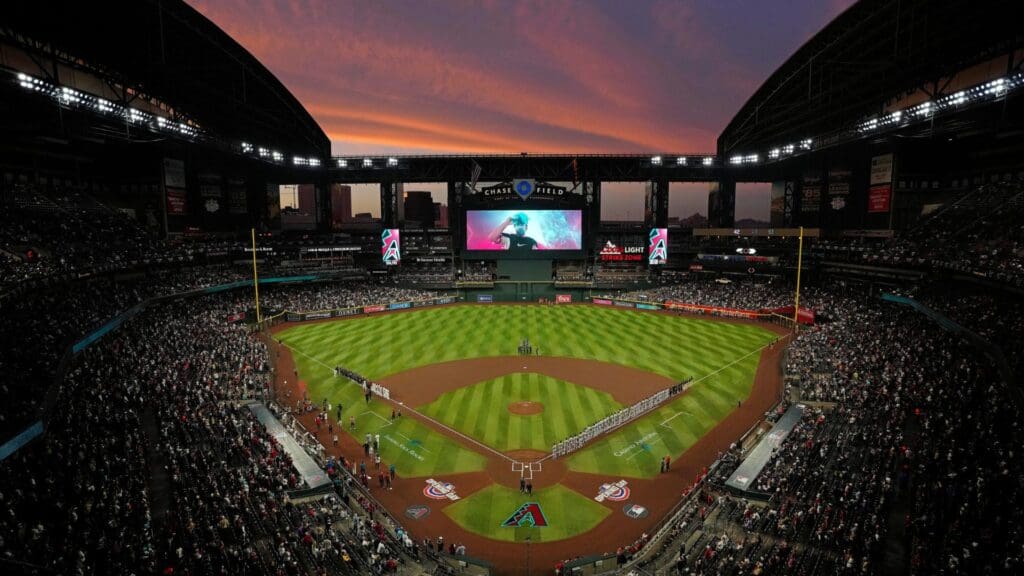 The sun sets as Diamondbacks players are introduced during Opening Day 2024 at Chase Field.