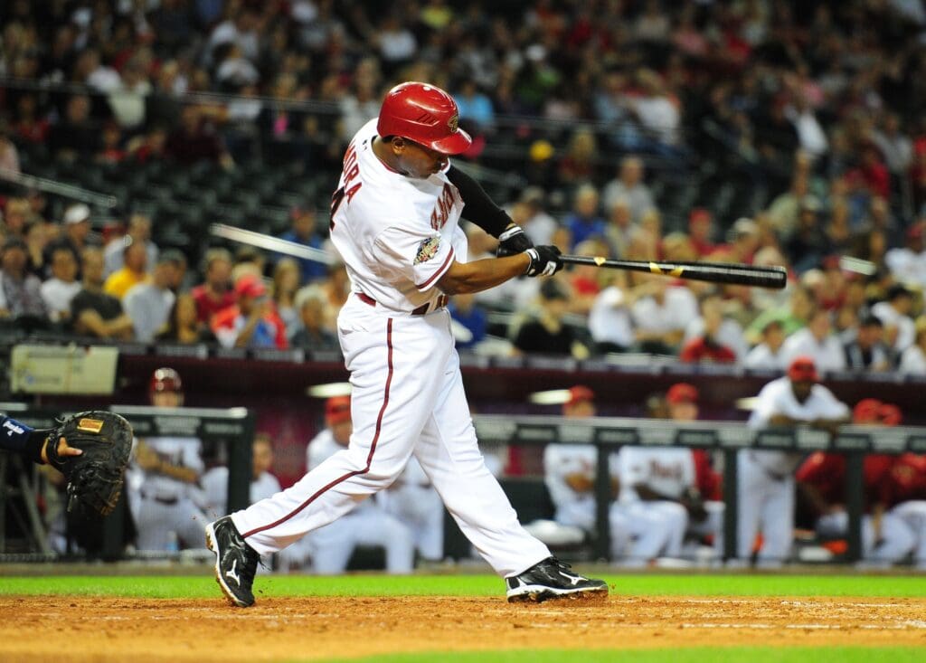 Apr. 11, 2011; Phoenix, AZ, USA; Arizona Diamondbacks batter Melvin Mora hits an RBI single in the fourth inning against the St. Louis Cardinals at Chase Field.