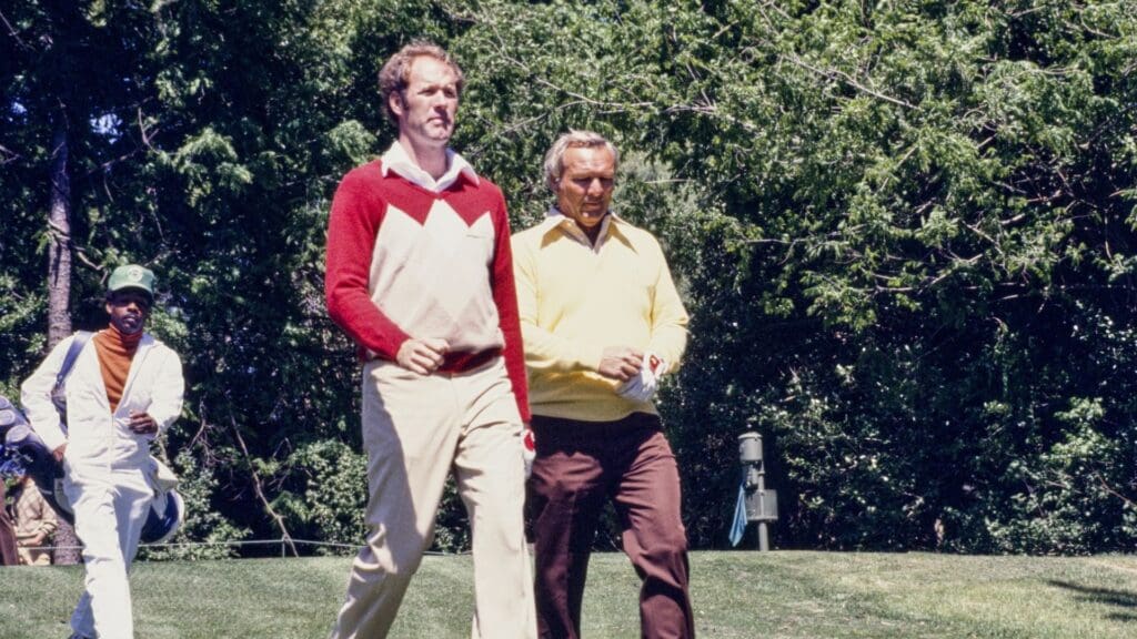 04/06/1977; Augusta, Georgia, USA; Arnold Palmer and another golfer walk on fairway with caddie behind at the Augusta National Golf Course during the 1977 Masters.