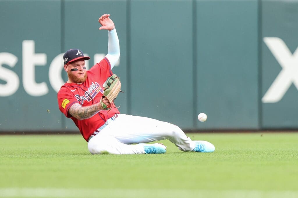 Jun 13, 2025; Cumberland, Georgia, USA; Atlanta Braves outfielder Alex Verdugo (8) makes an error in the field against the Colorado Rockies during the second inning at Truist Park.