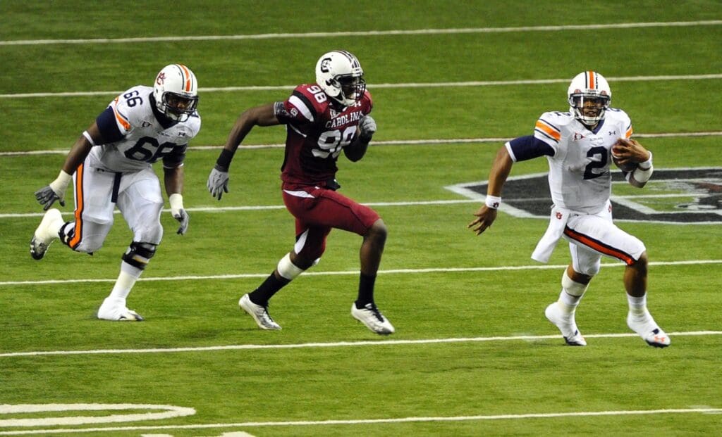 Dec 4, 2010; Atlanta, GA, USA; Auburn Tigers quarterback Cam Newton (2) scrambles during the third quarter of the 2010 SEC championship game against the South Carolina Gamecocks at the Georgia Dome.
