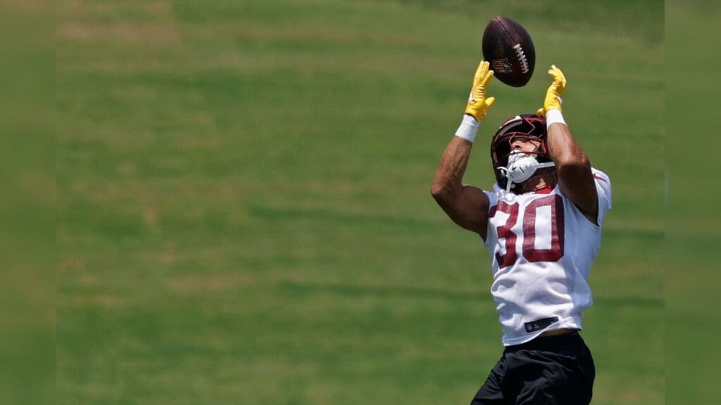 Jun 10, 2025; Ashburn, VA, USA; Washington Commanders running back Austin Ekeler (30) catches a pass during drills on day one of minicamp at Commanders Park.