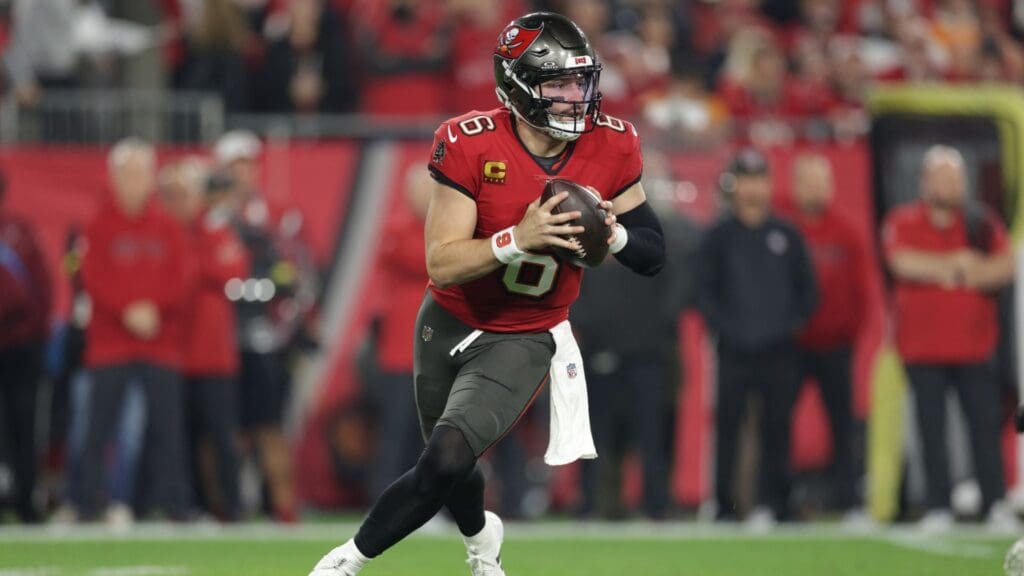 Jan 12, 2025; Tampa, Florida, USA; Tampa Bay Buccaneers quarterback Baker Mayfield (6) rolls out during the first quarter of a NFC wild card playoff against the Washington Commanders at Raymond James Stadium.