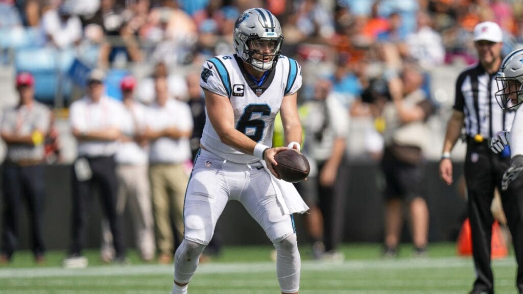 Sep 11, 2022; Charlotte, North Carolina, USA; Carolina Panthers quarterback Baker Mayfield (6) prepares to hand off to running back Christian McCaffrey (22) during the second half against the Cleveland Browns at Bank of America Stadium.