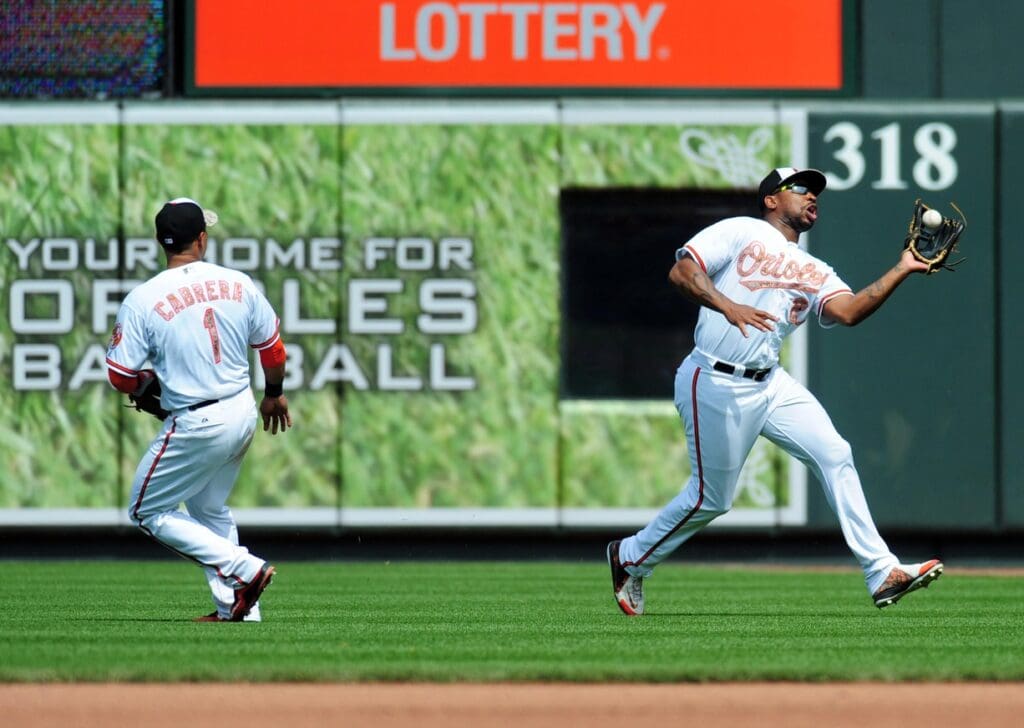 May 25, 2015; Baltimore, MD, USA; Baltimore Orioles outfielder Delmon Young (27) catches a fly ball in the seventh inning against the Houston Astros at Oriole Park at Camden Yards. The Orioles won 4-3.