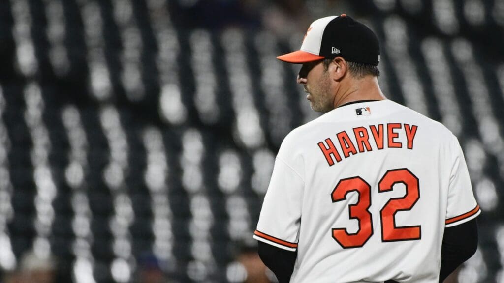 Baltimore Orioles starting pitcher Matt Harvey (32) looks to home plate before throwing a third inning pitch against the Kansas City Royals at Oriole Park at Camden Yards