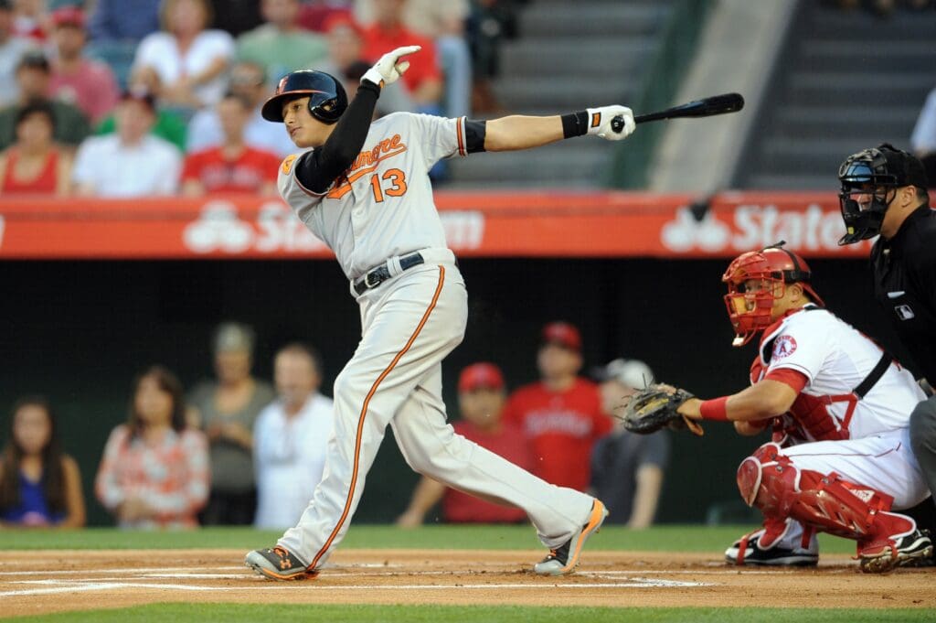 May 2, 2013; Anaheim, CA, USA; Baltimore Orioles third baseman Manny Machado (13) hits a single against the Los Angeles Angels during the first inning at Angel Stadium of Anaheim.