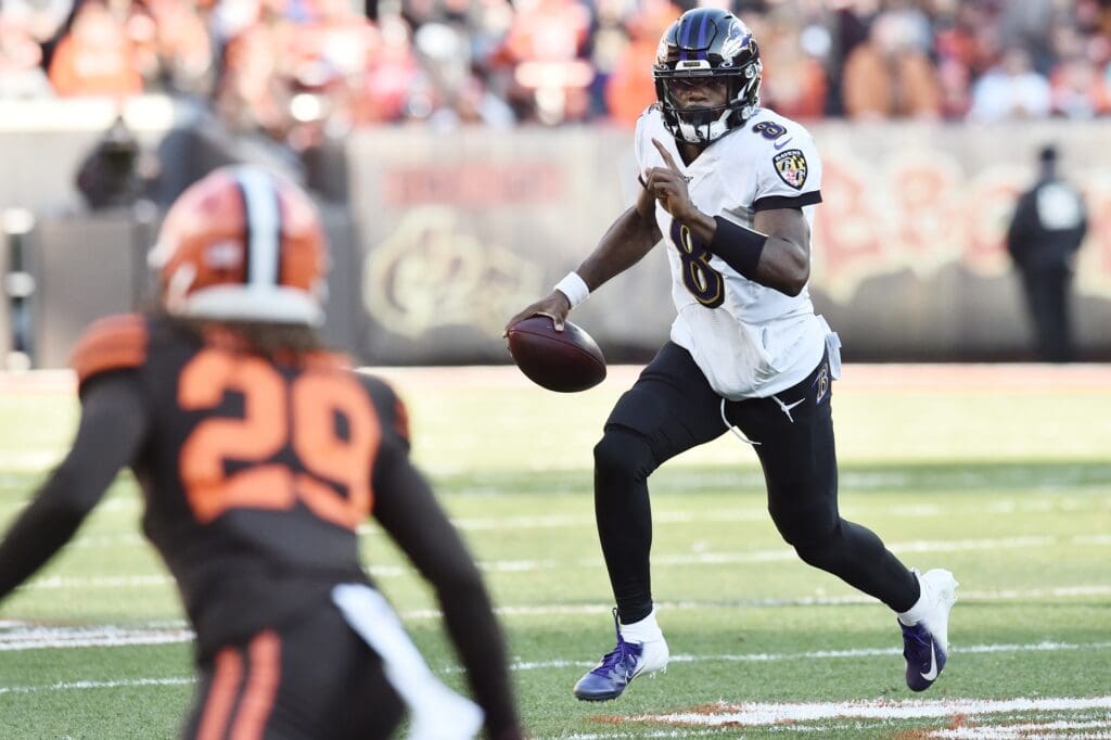Baltimore Ravens quarterback Lamar Jackson (8) runs the ball as Cleveland Browns defensive back Sheldrick Redwine (29) defends during the second half at FirstEnergy Stadium.