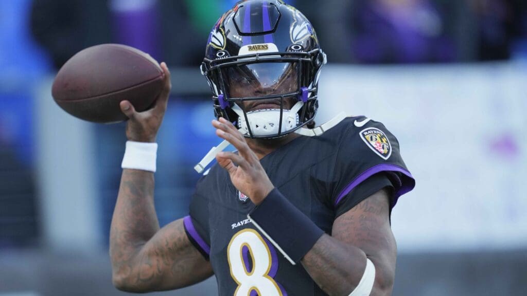 Dec 1, 2024; Baltimore, Maryland, USA; Baltimore Ravens quarterback Lamar Jackson (8) warms up prior the game against the Philadelphia Eagles at M&T Bank Stadium.