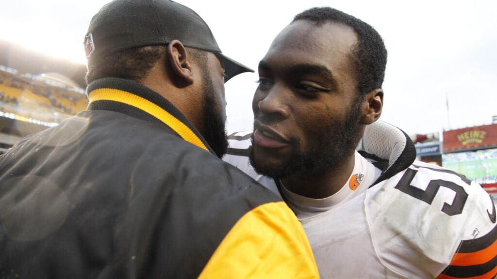 Dec 29, 2013; Pittsburgh, PA, USA; Pittsburgh Steelers head coach Mike Tomlin (left) and Cleveland Browns outside linebacker Barkevious Mingo (51) embrace after their game at Heinz Field. The Pittsburgh Steelers won 20-7