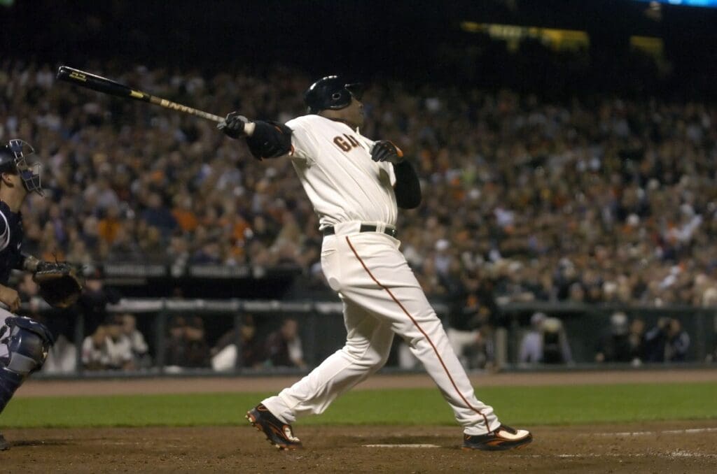 June 22, 2007; San Francisco, CA, USA; San Francisco Giants left fielder Barry Bonds (25) hits his 749th homerun off of New York Yankees relief pitcher Scott Proctor (not pictured) during the 8th inning at AT&T Park in San Francisco, CA. Bonds is seven homeruns away from breaking the all-time homerun record currently held by Hank Aaron.