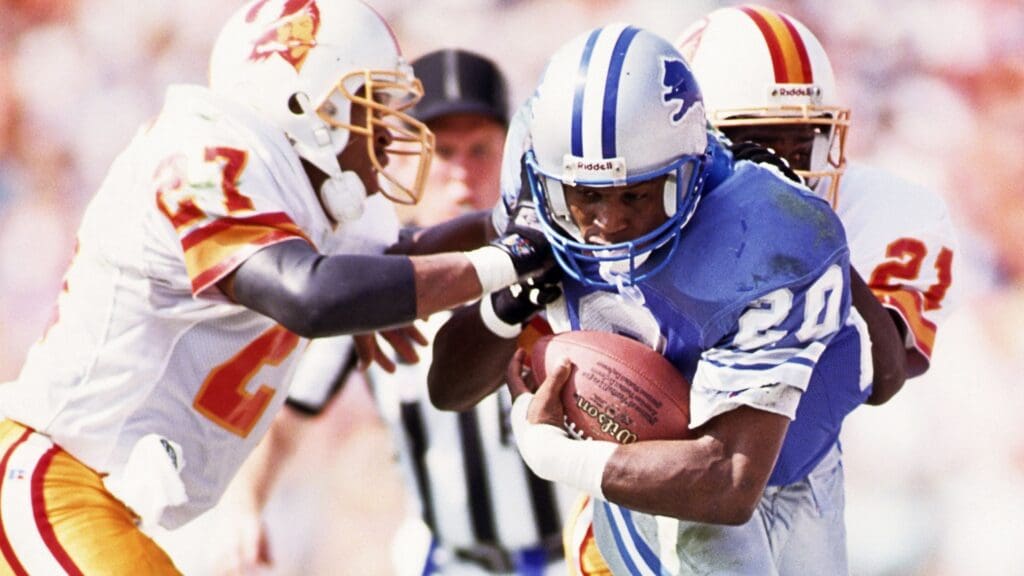 Oct 25, 1992; Tampa, FL, USA; FILE PHOTO; Detroit Lions running back Barry Sanders (20) in action against Tampa Bay Buccaneers defensive backs Darrell Fullington (27) and Milton Mack (21) at Tampa Stadium.