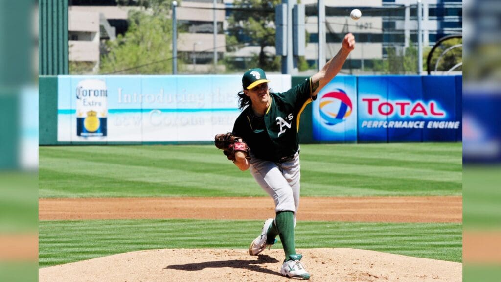 Mar 31, 2015; Tempe, AZ, USA; Oakland Athletics starting pitcher Barry Zito (75) throws during the first inning against the Los Angeles Angels at Tempe Diablo Stadium.