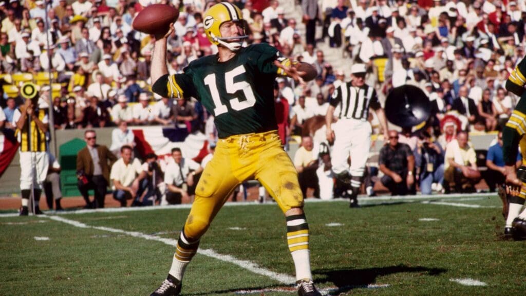 Jan 15, 1967; Los Angeles, CA, USA; FILE PHOTO; Green Bay Packers quarterback (15) Bart Starr in action against the Kansas City Chiefs during Super Bowl I at The Coliseum. The Packers defeated the Chiefs 35-10 to win the first meeting of the AFL versus the NFL for the world championship