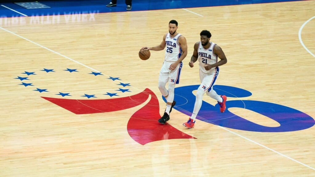 Jun 20, 2021; Philadelphia, Pennsylvania, USA; Philadelphia 76ers guard Ben Simmons (25) and center Joel Embiid (21) bring the ball up court against the Atlanta Hawks during the second quarter of game seven of the second round of the 2021 NBA Playoffs at Wells Fargo Center.