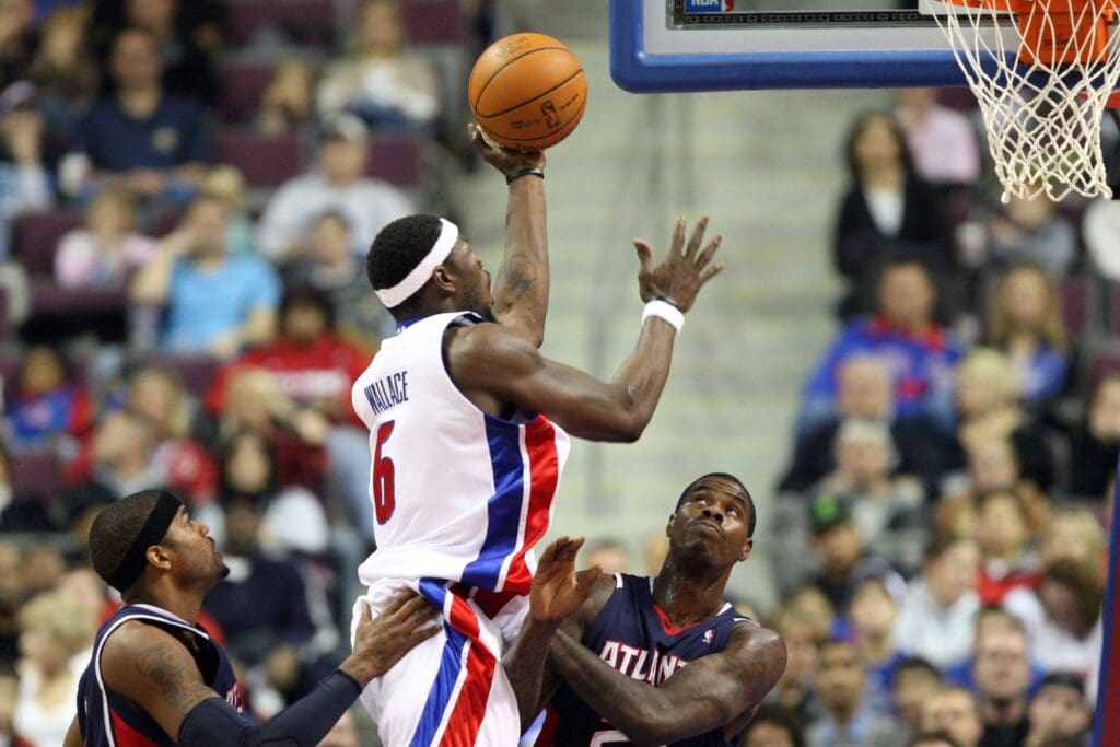 November 29, 2009; Auburn Hills, MI, USA; Detroit Pistons forward Ben Wallace (6) scores over Atlanta Hawks forward Marvin Williams (24) in the first quarter at The Palace of Auburn Hills.