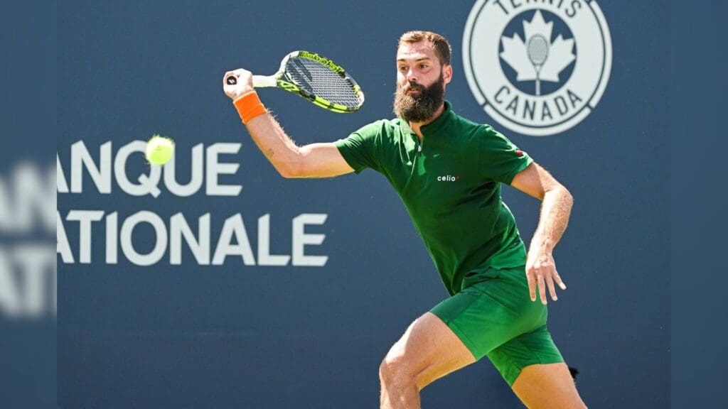 Aug 7, 2022; Montreal, Quebec, Canada; Benoit Paire (FRA) hits a shot against Marc-Andrea Huesler (SUI) (not pictured) in second round qualifying play at IGA Stadium.