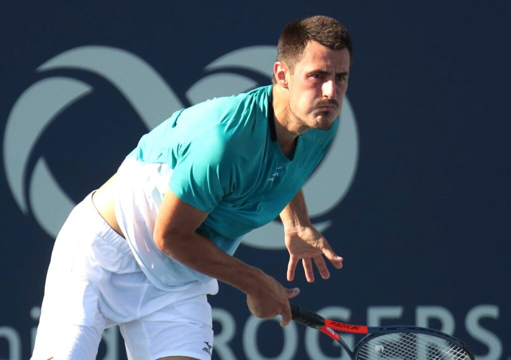 Aug 5, 2019; Montreal, Quebec, Canada; Bernard Tomic from Australia serves against Roberto Bautista Agut from Spain (not pictured) during the Rogers Cup tennis tournament at Stade IGA.
