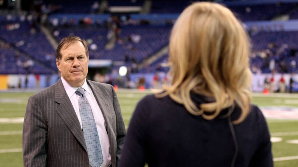 Feb 5, 2012; Indianapolis, IN, USA; New England Patriots head coach Bill Belichick greets a reporter before Super Bowl XLVI against the New York Giants at Lucas Oil Stadium.